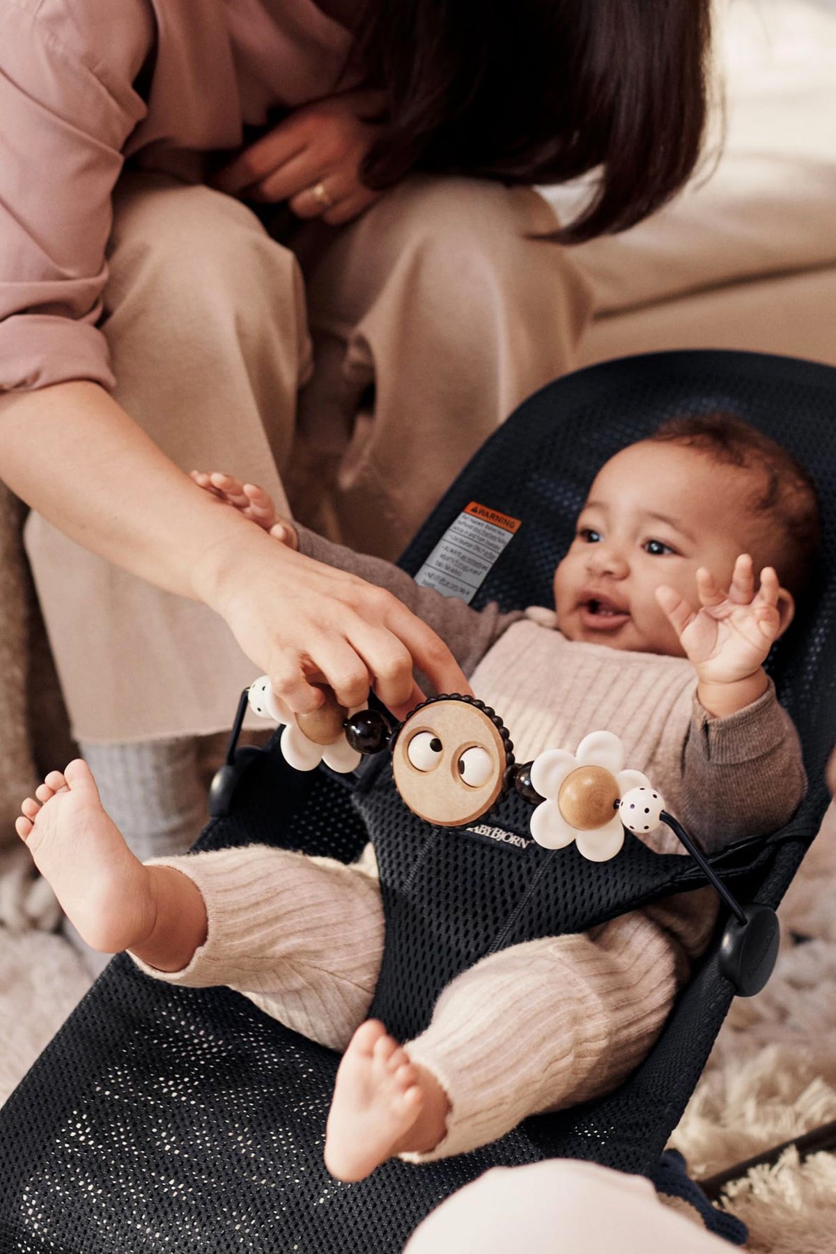 BabyBjörn lightweight bar attaches easily to Bouncer Balance Soft and Bliss.