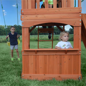 Backyard Discovery Atlantis built-in sandbox area invites sensory play.