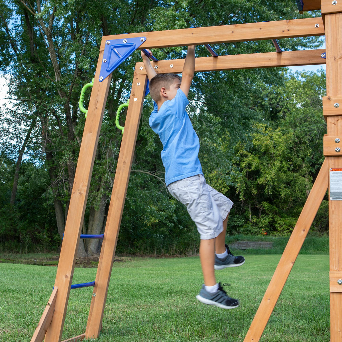 Backyard Discovery Rock Wall Ladder providing safe ascent to the deck.
