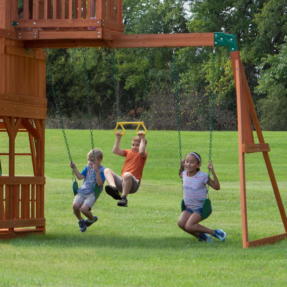 Skyfort II belt swings and trapeze for cooperative fun.