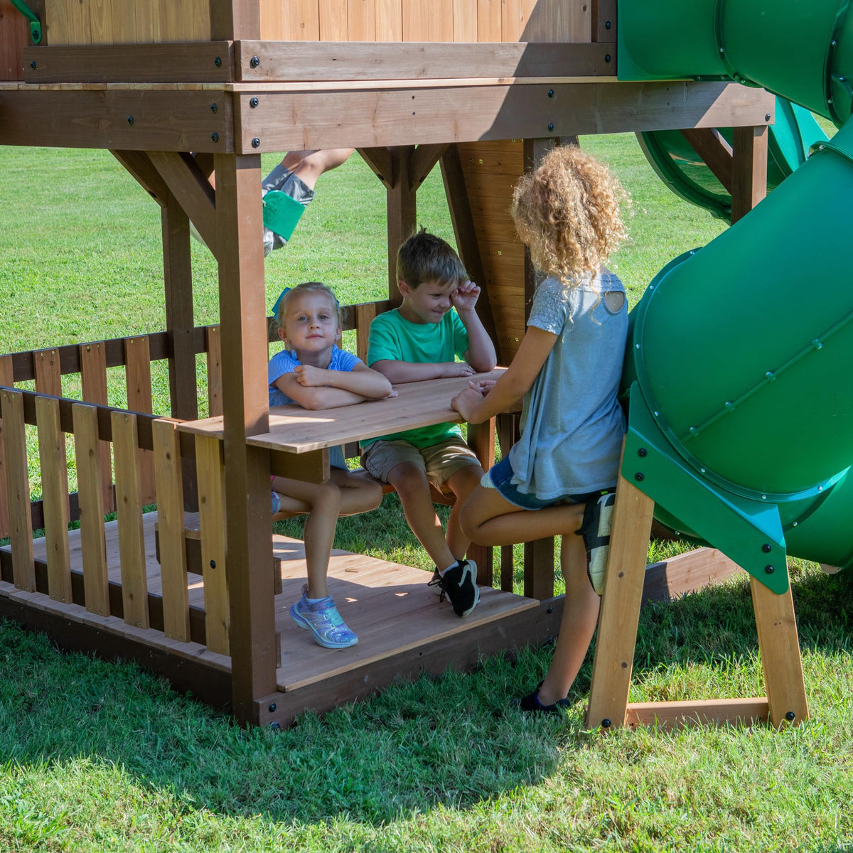 Backyard Discovery Skyfort II two belt swings and web swing for energetic outdoor play.