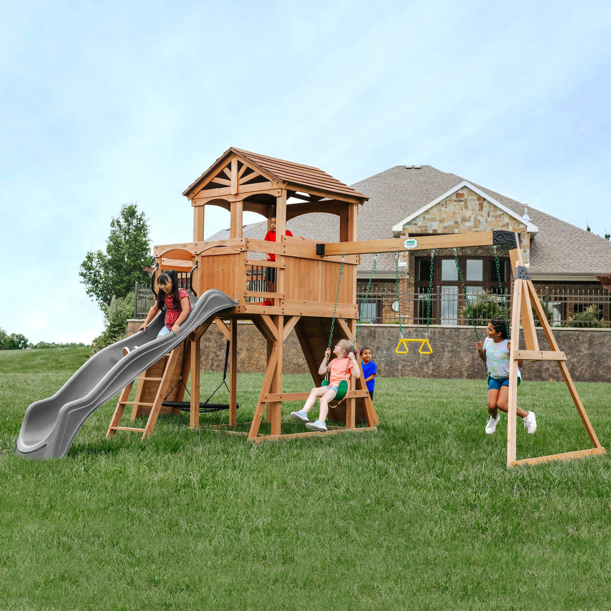 Backyard Discovery Sterling Point wooden bridge connects elevated clubhouse for adventure