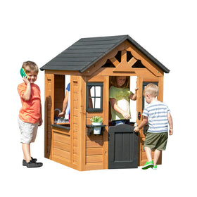 Backyard Discovery Sweetwater playhouse cedar windows invite natural light for creativity.