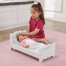 Badger Basket white finish with scalloped details enhances playroom aesthetics.