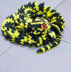 BANPIWOLG snake model on desk brightens workspace with playful fantasy vibes.