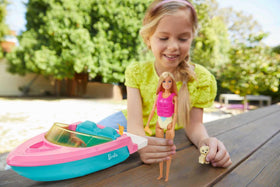 Barbie boat accommodates up to three dolls in the cockpit area for group adventures