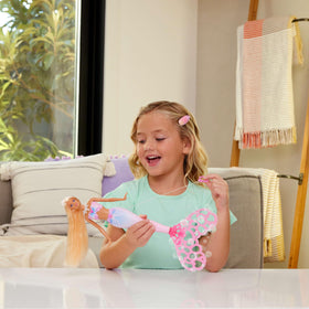 Barbie Bubble Sparkle Mermaid doll tail spin creates waves of bubbles for play