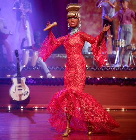 Barbie Celia Cruz with glamorous updo and makeup for stage-ready flair.