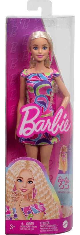 Barbie doll with colorful dress invites kids to mix-and-match play.