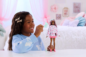 Barbie Cutie Reveal Cuddly Doll with pink-streaked hair for styling adventures.