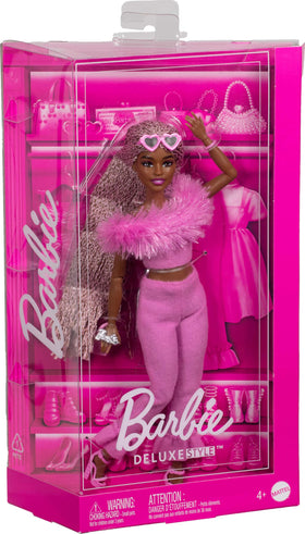 Barbie Deluxe Style Doll 4 includes heart-shaped sunglasses and pink purse for styling.