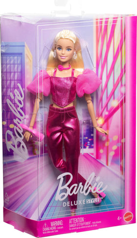 Barbie Deluxe Style Doll bow clutch and pink heels complete the ensemble.