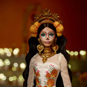 Barbie Dia de Muertos doll with marigold crown, ideal for festive altar displays.