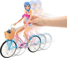 Barbie doll seated on the bike, ready for ride-along adventures.