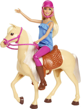 Doll wearing pink helmet and tall boots for confident riding storytelling