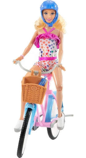 Barbie doll romper with rainbow heart print for adventurous looks.