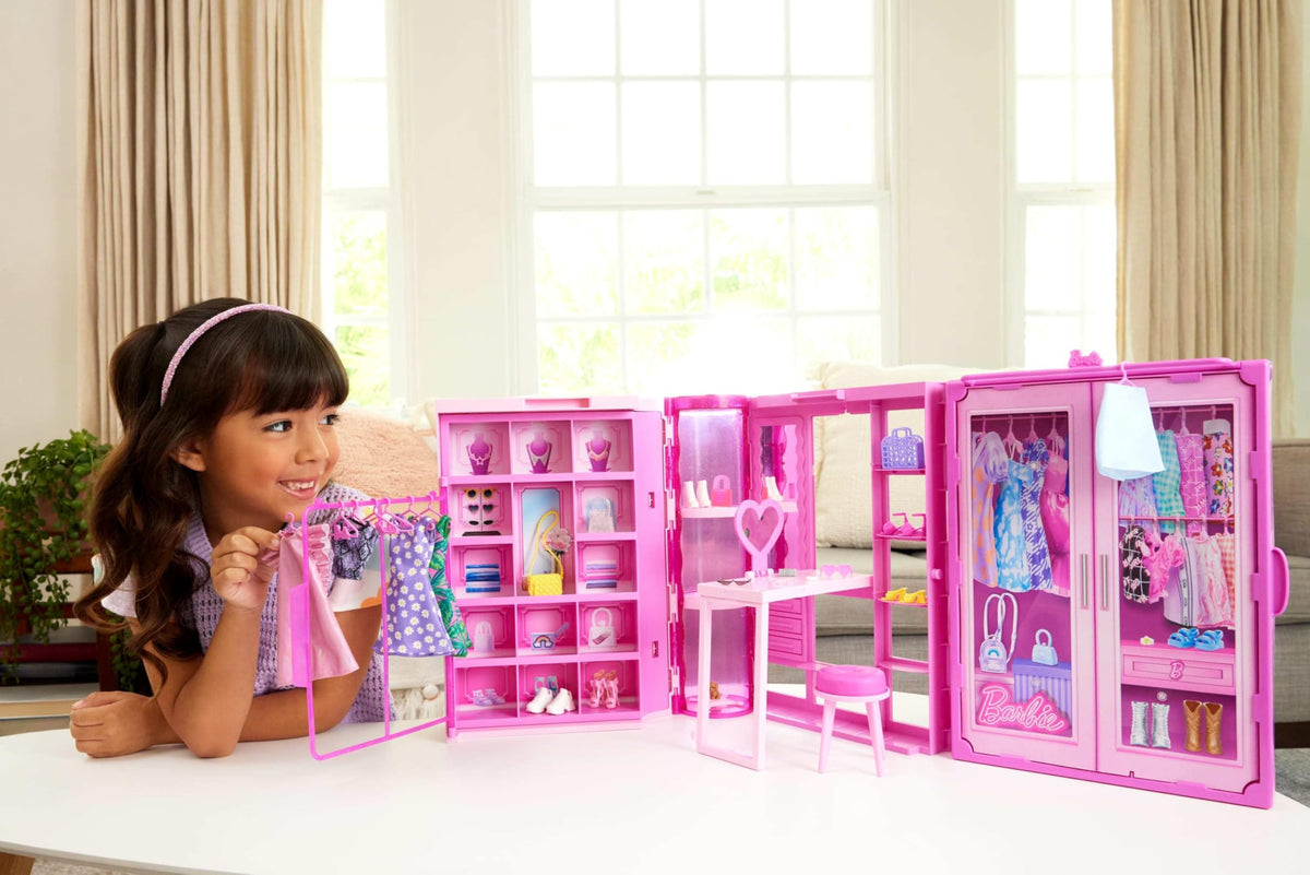 Barbie Dream Closet clothing racks display over 25 pieces for mix-and-match outfits.