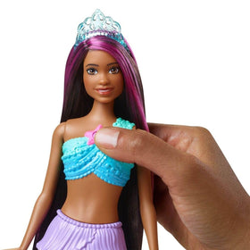 Barbie Dreamtopia Twinkle Lights mermaid doll features rainbow fins for fantasy styling.