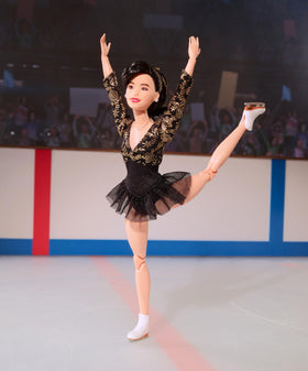 Barbie Inspiring Women Kristi Yamaguchi with silvery earrings and bouquet