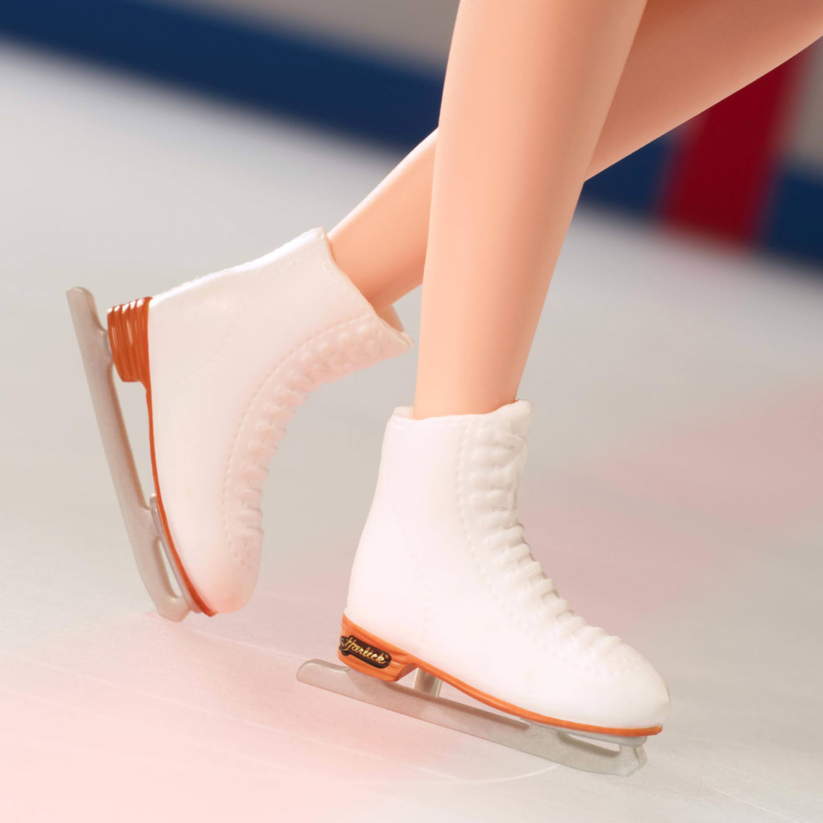 Barbie Inspiring Women Kristi Yamaguchi white skating skates for display