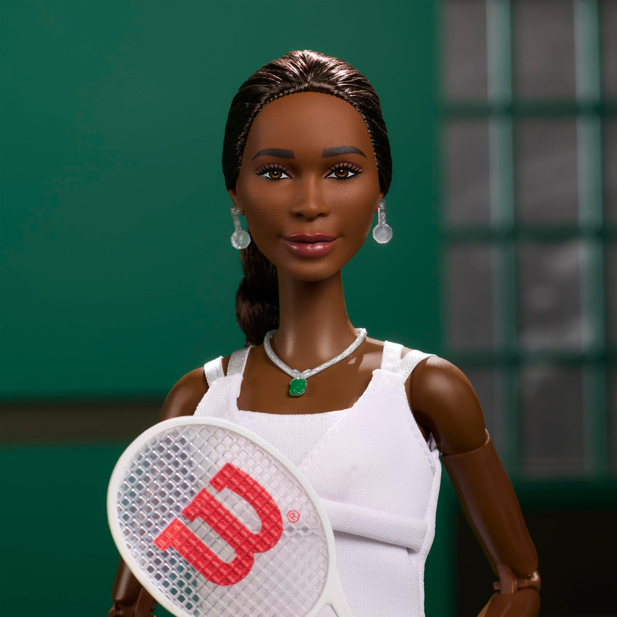 Barbie Venus Williams doll with tennis racket, great for imaginative play and display.