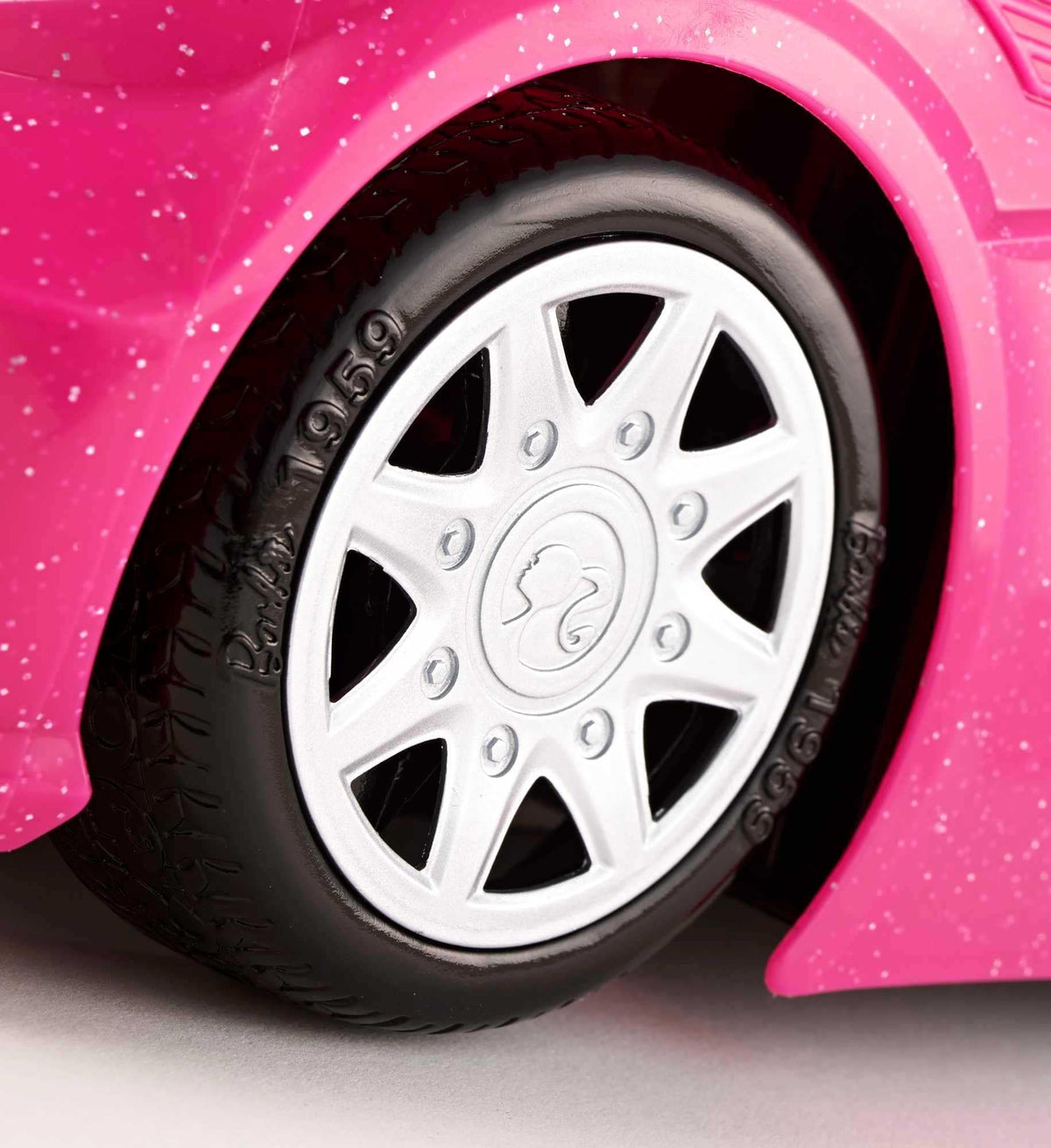 Barbie car interior with seat belts showcases safe, believable play settings.