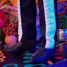 Barbie Ken Day of the Dead calavera face paint highlights festive character