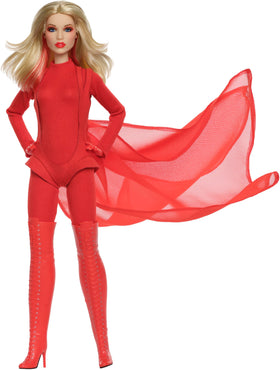 Close-up of Barbie Kylie Minogue doll face with vivid red lips for display.