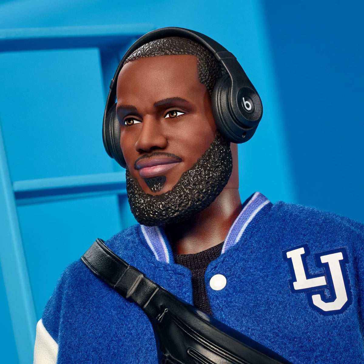 Barbie LeBron Kenbassadors doll wearing headphones for a sporty, cinematic pose.