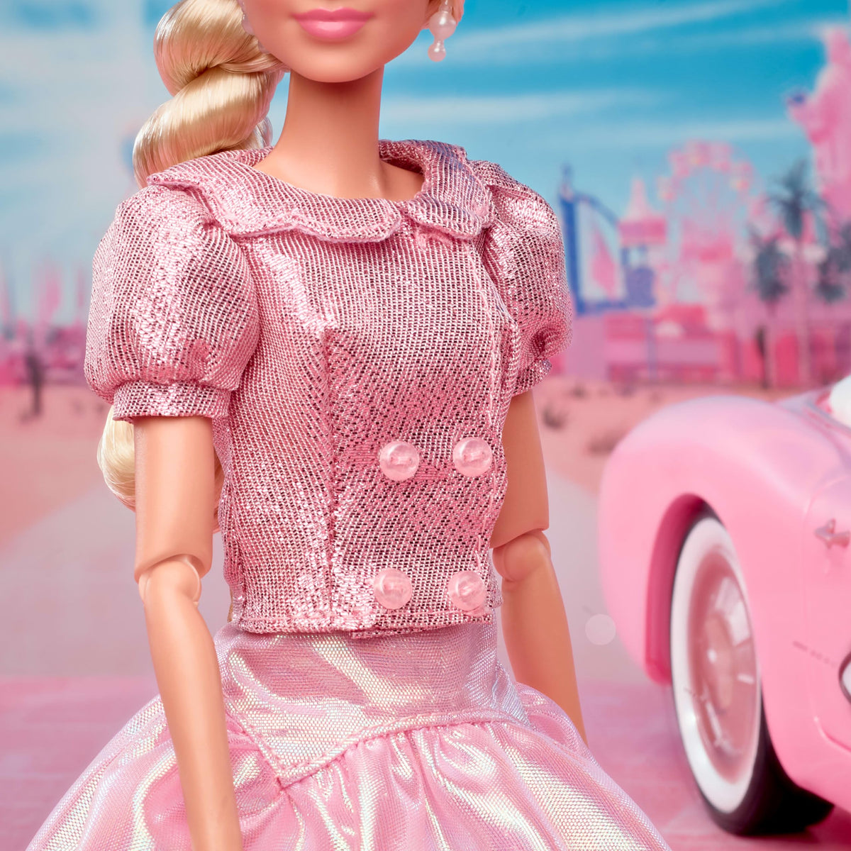 barbie the movie doll’s blonde hair styled in side twist with ribbon, ready for display