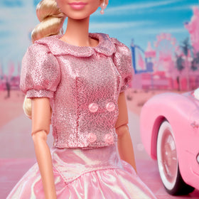 barbie the movie doll’s blonde hair styled in side twist with ribbon, ready for display