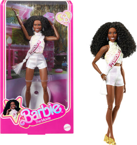 Barbie The Movie President doll wearing a white blouse and sash, ideal for display and collection.