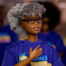 Barbie Opal Lee doll in white pants and sneakers for display-ready styling.