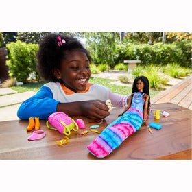 Barbie orange boots and sunglasses accessorize outdoor adventures