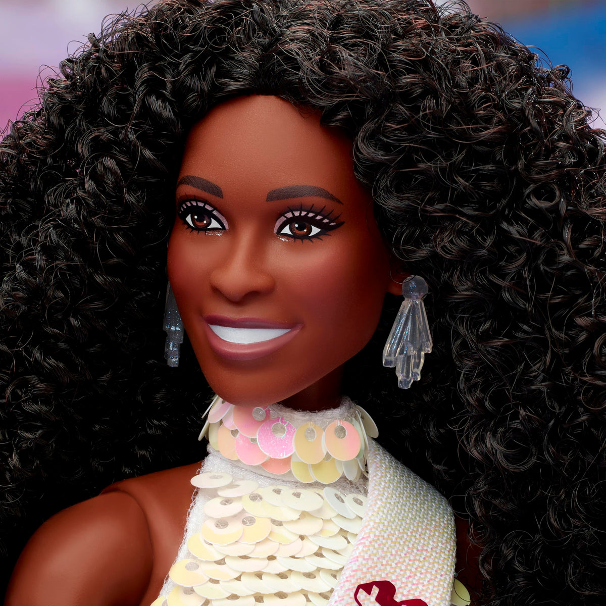 Barbie The Movie President doll with dark curly hair, a striking shelf centerpiece.