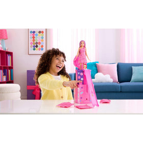 Barbie Rise & Surprise doll slide unfolds as the puppy bursts into birthday party fun.