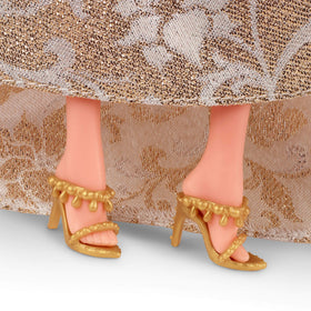 Barbie Signature Doll gold drop earrings add festive sparkle.