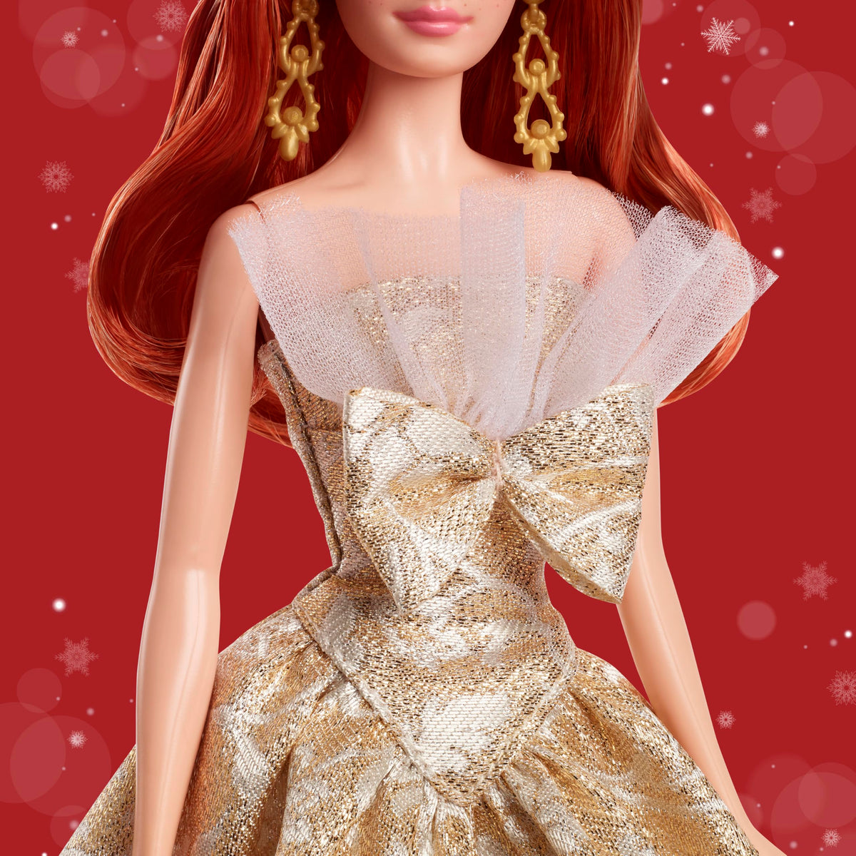 Barbie Signature doll featuring gold drop earrings for authentic sparkle.