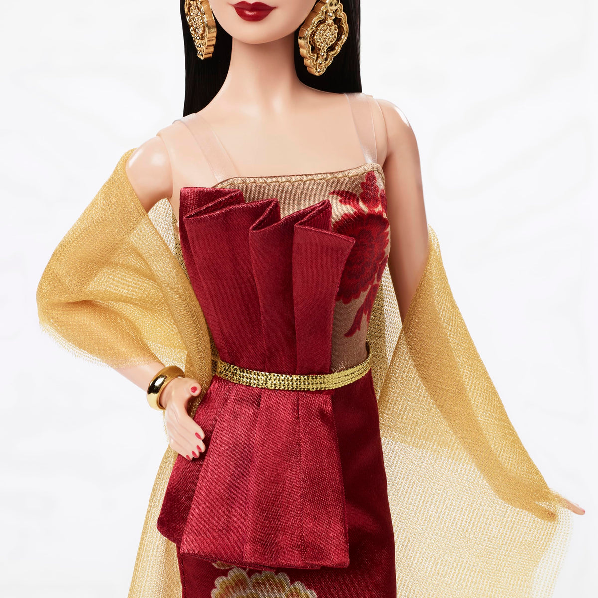 Sheer golden wrap adds luxe flair to Barbie Lunar New Year look