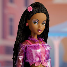 Barbie Signature Jai with tinted sunnies and gold belly chain for bold accessorizing.