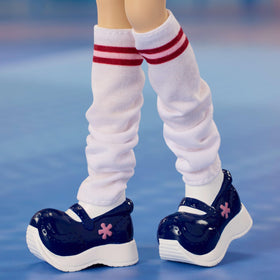 Barbie Signature Nolee leg warmers and jelly shoes for retro vibes.