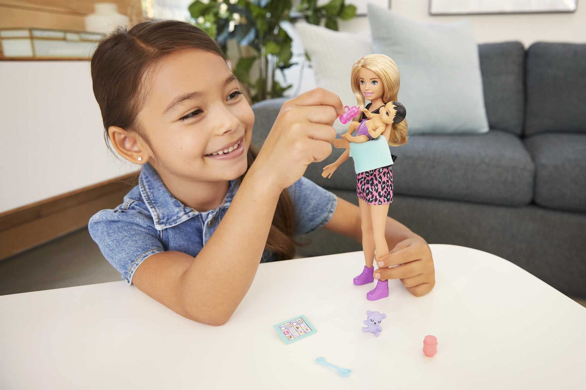 Barbie Skipper Babysitters Inc set baby doll with cloth diaper for realistic role-play.