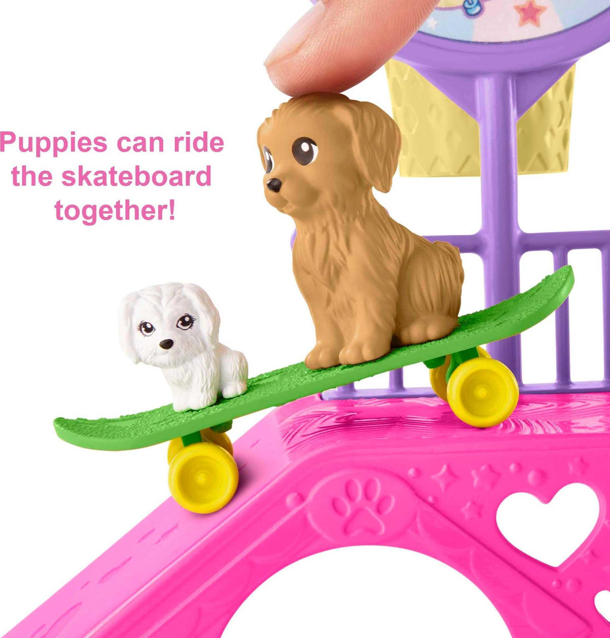 Barbie Chelsea with two puppies on skateboard for cooperative fun.