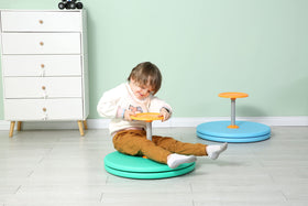 BARNEY KAITE BS Spinner-X in family playroom illustrating versatile use at home.