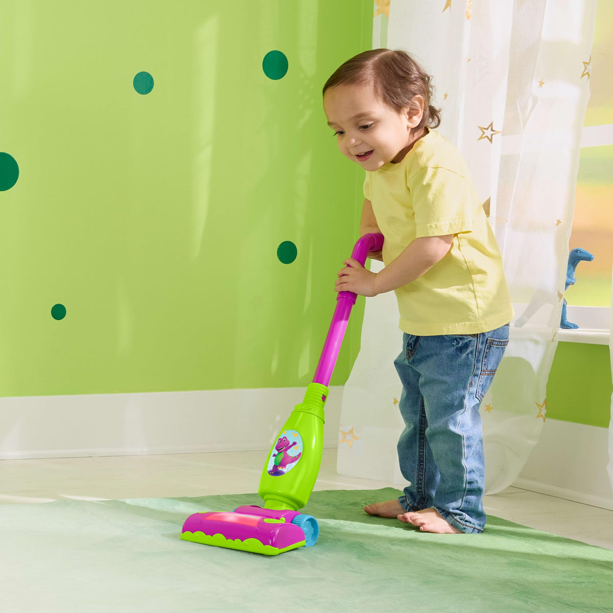 Barneys World toddler clean up vacuum side view showing rolling action for movement