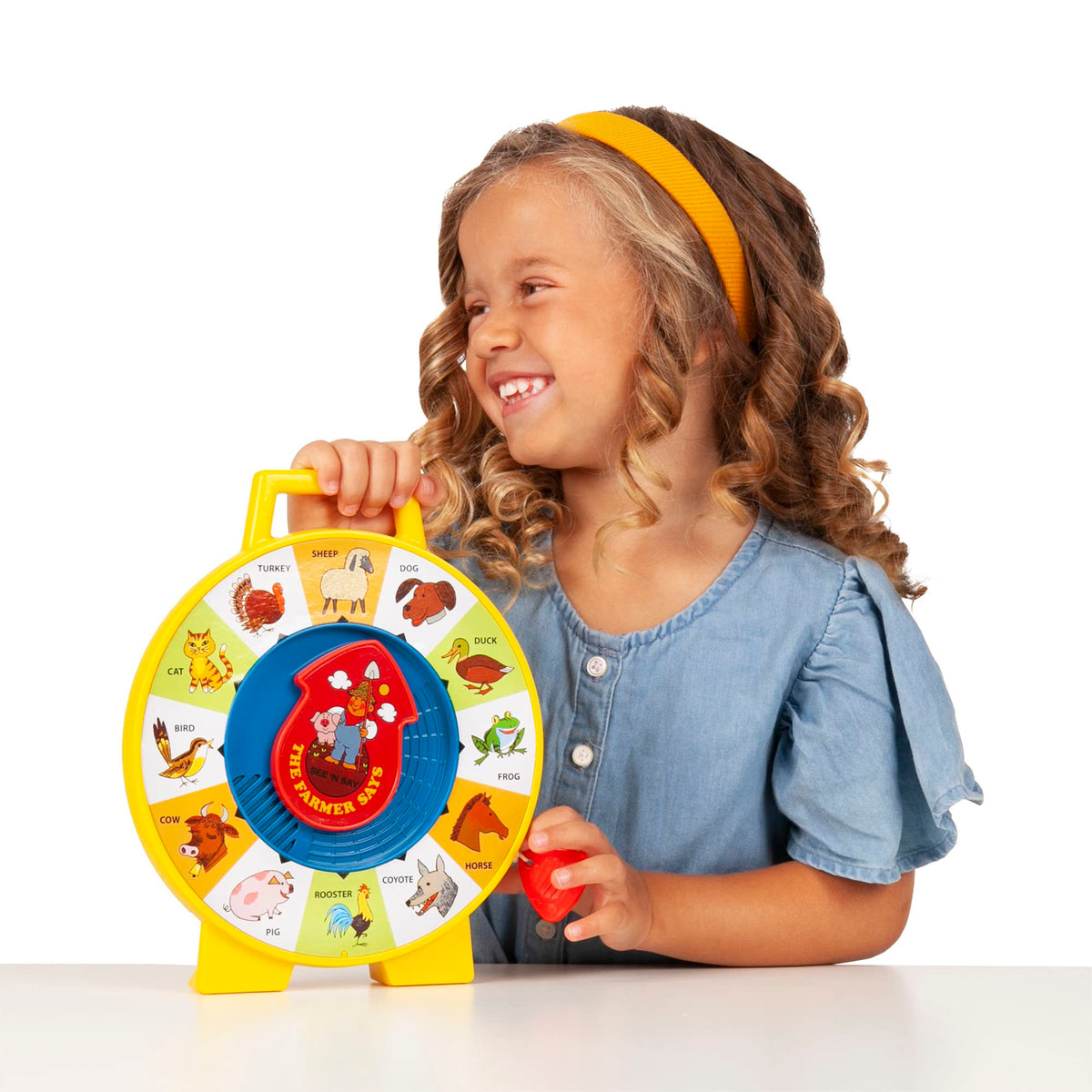 Basic Fun Fisher-Price See n Say cord play illustrates cause-and-effect with animal sounds.