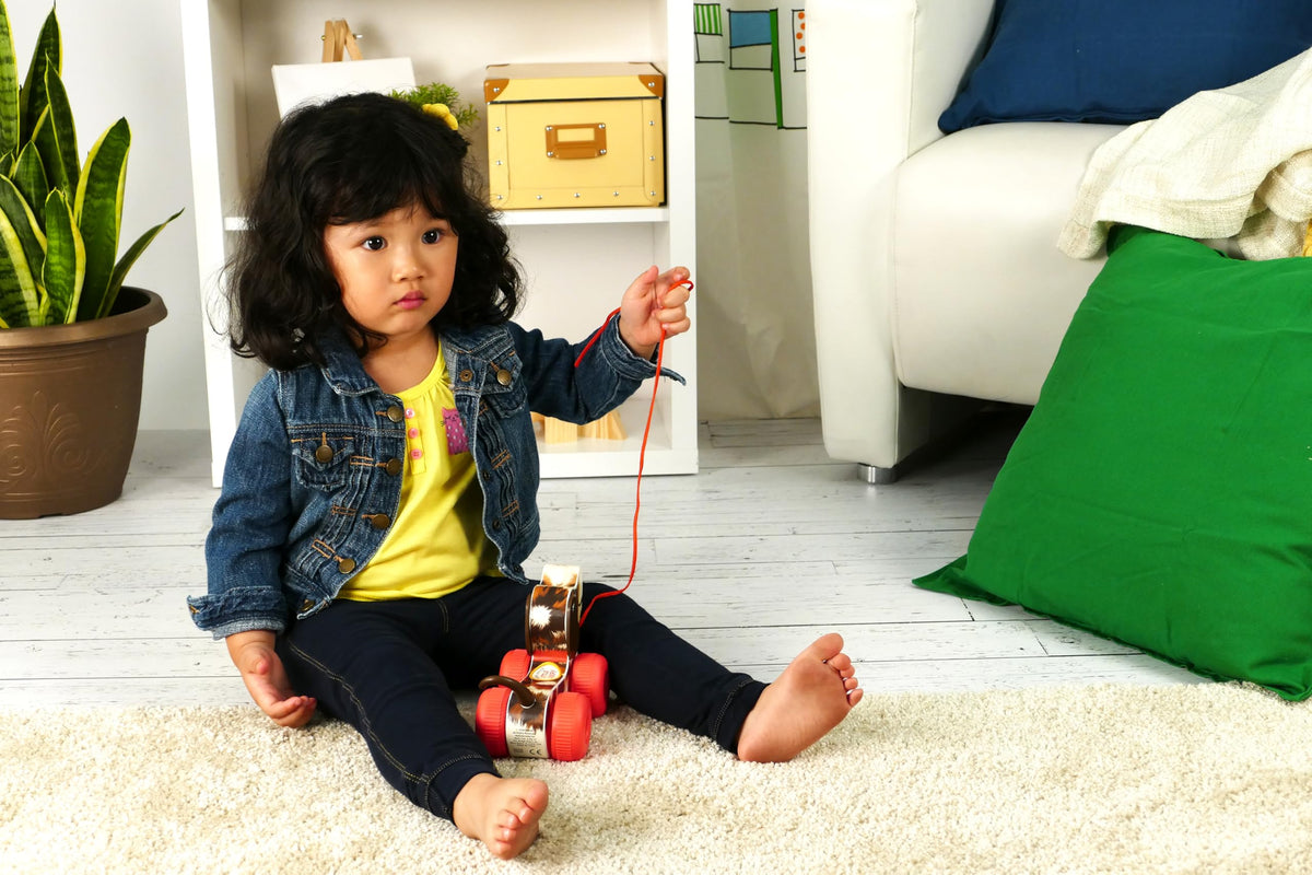 Basic Fun Fisher-Price Little Snoopy Toy pull cord activates movement and sound.