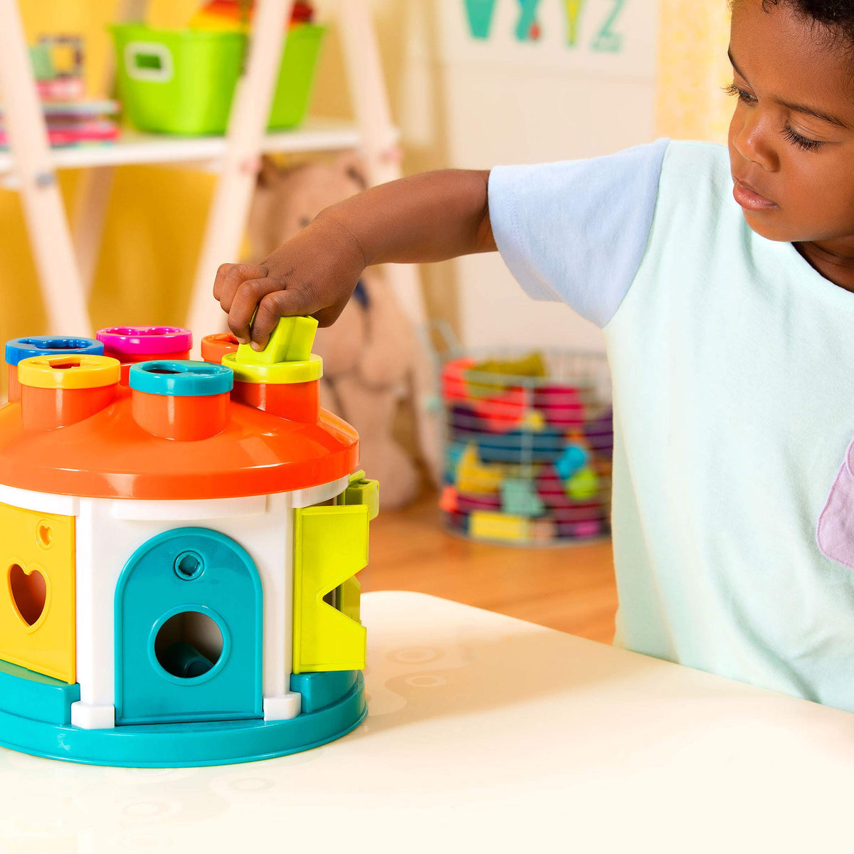 Battat Shape Sorter House colorful blocks inspire imaginative sorting.