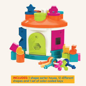 Battat Shape Sorter House window lets blocks slide through holes.