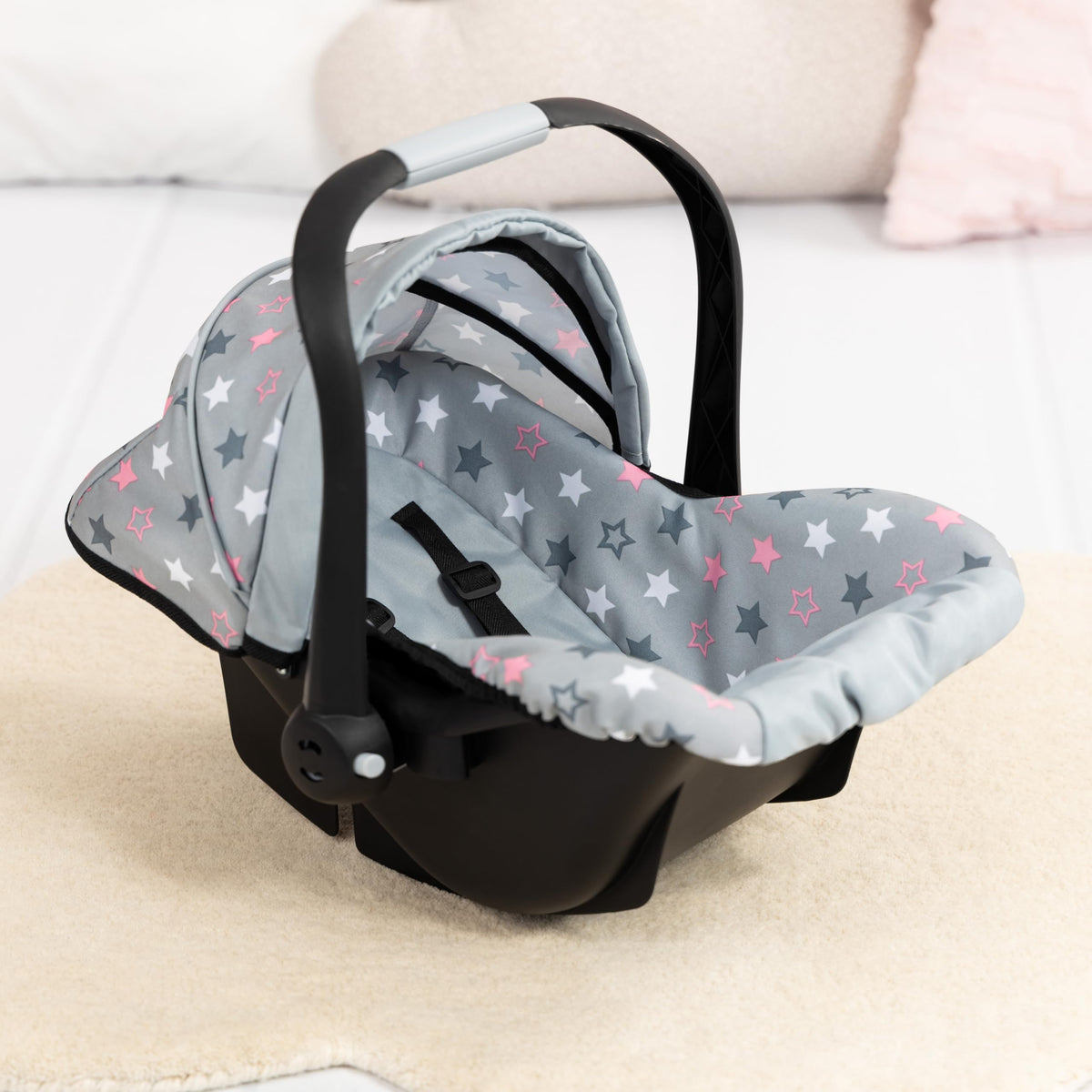 Bayer car seat with secure harness keeps dolls safely in place.